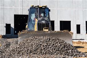 Site & Land Development: A Caterpillar D3 grades a warehouse ramp. 
