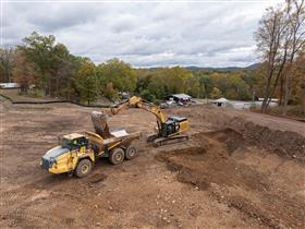 Lehigh Valley Division: A Caterpillar 349F loads a Komatsu HM400 with dirt on a site development project in Belvidere, NJ. 