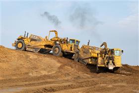 Site & Land Development: Two Caterpillar scrapers work a cut on a large warehouse site in Myerstown, PA.
