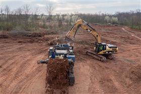 Site & Land Development: A land clearing crew works to remove trees and brush to make way for excavation to begin. 